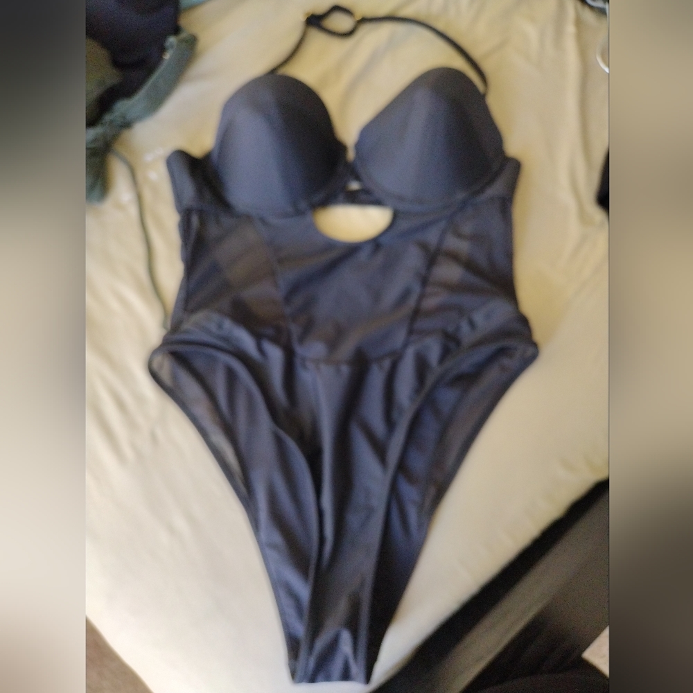 Herve ledger , forever 21 swimsuit. Sz 14 /lg. Black with mesh cutouts , padded,